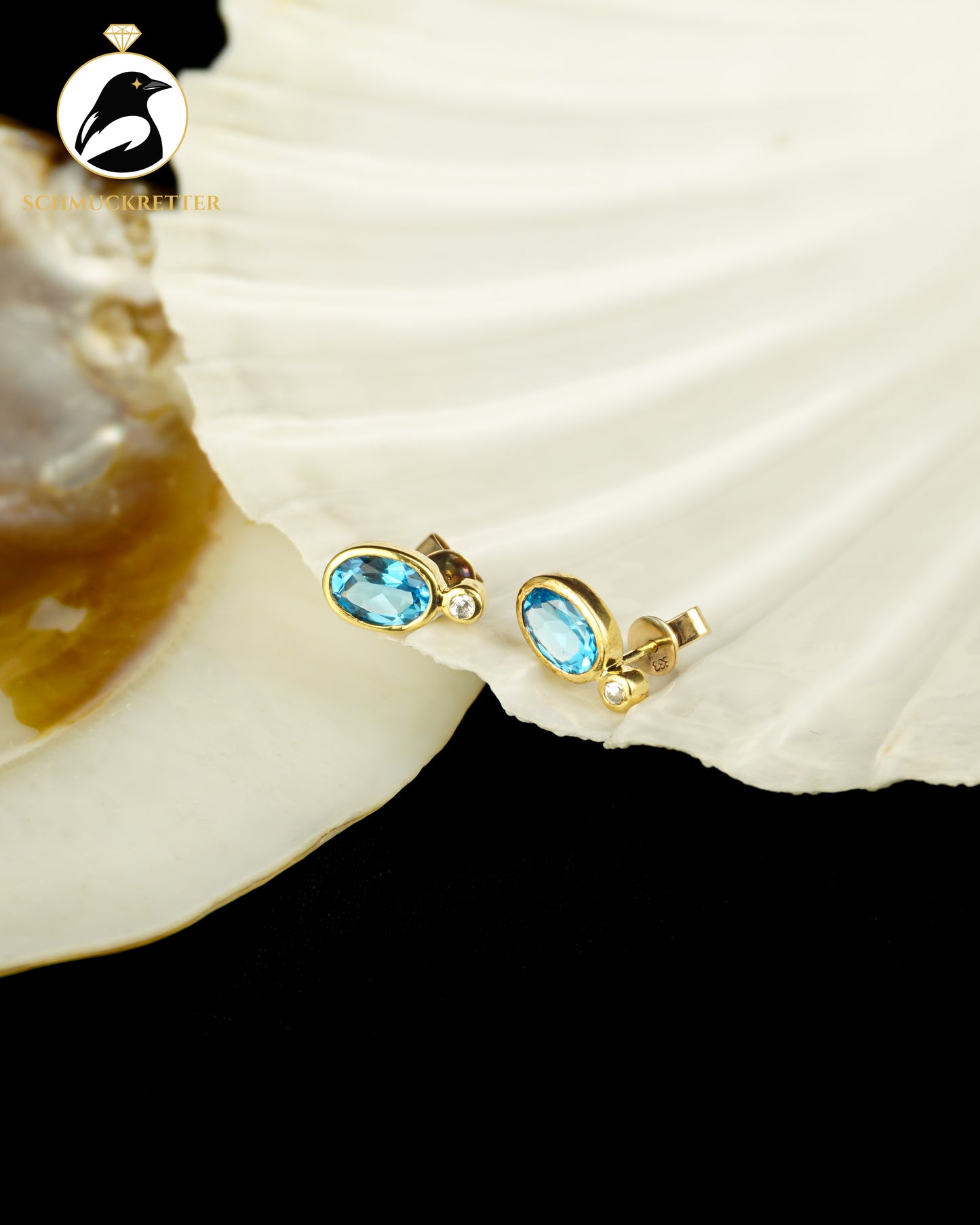 333 Gold Ohrstecker mit blauem Spinell & Zirkonia