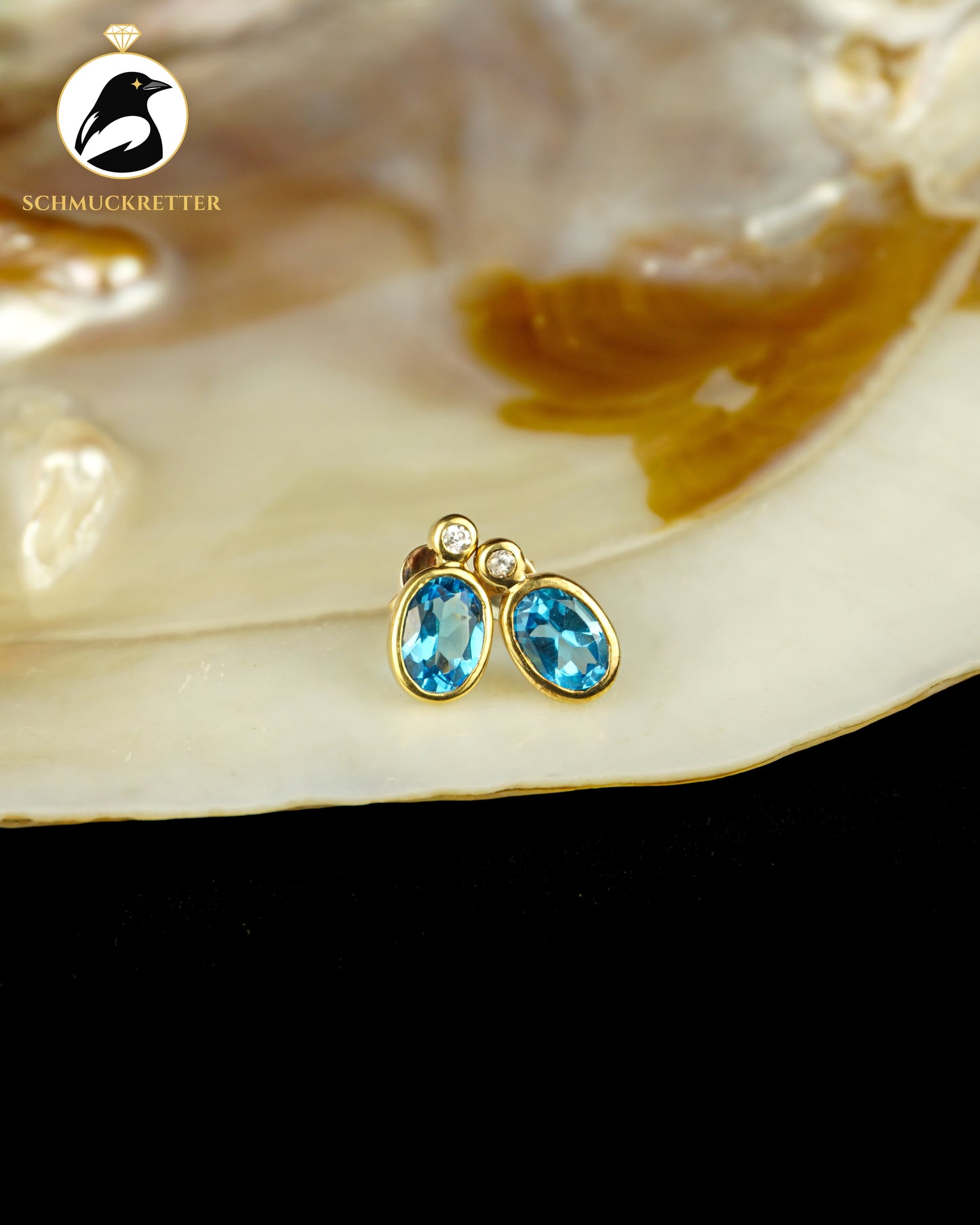 333 Gold Ohrstecker mit blauem Spinell & Zirkonia