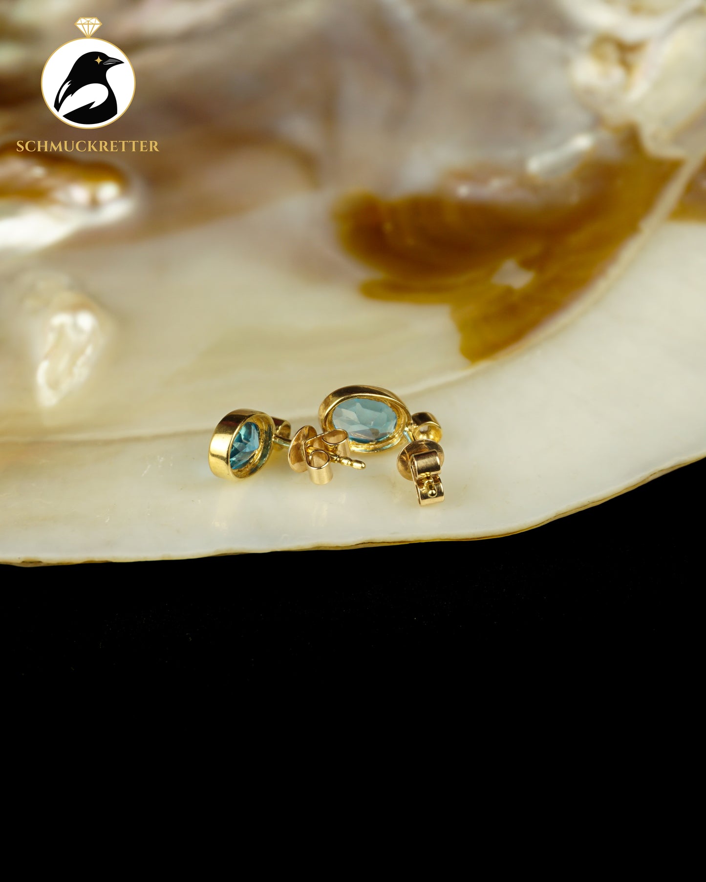 333 Gold Ohrstecker mit blauem Spinell & Zirkonia