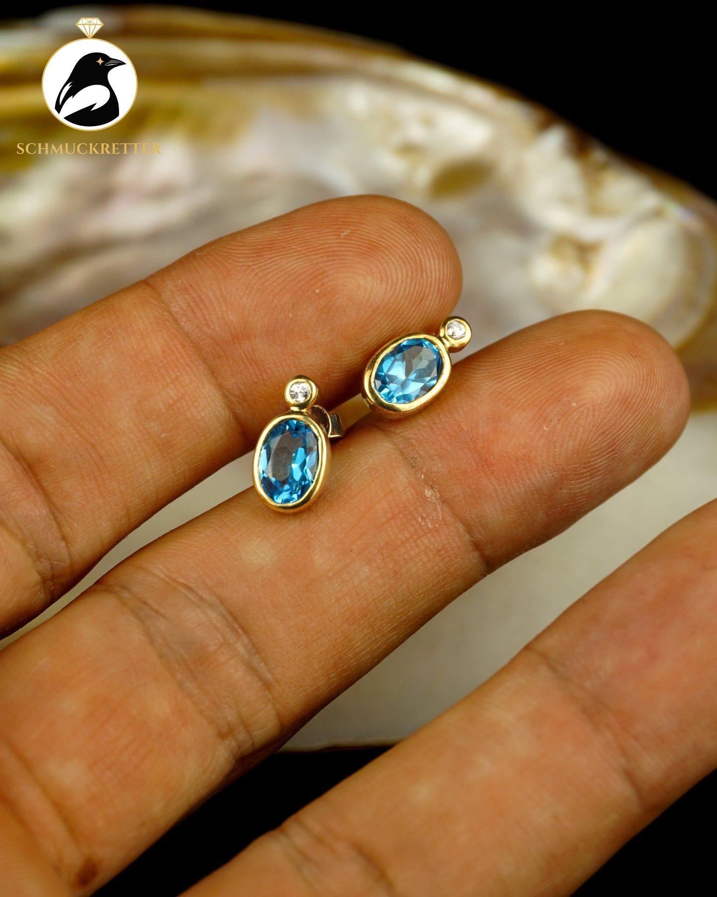 333 Gold Ohrstecker mit blauem Spinell & Zirkonia