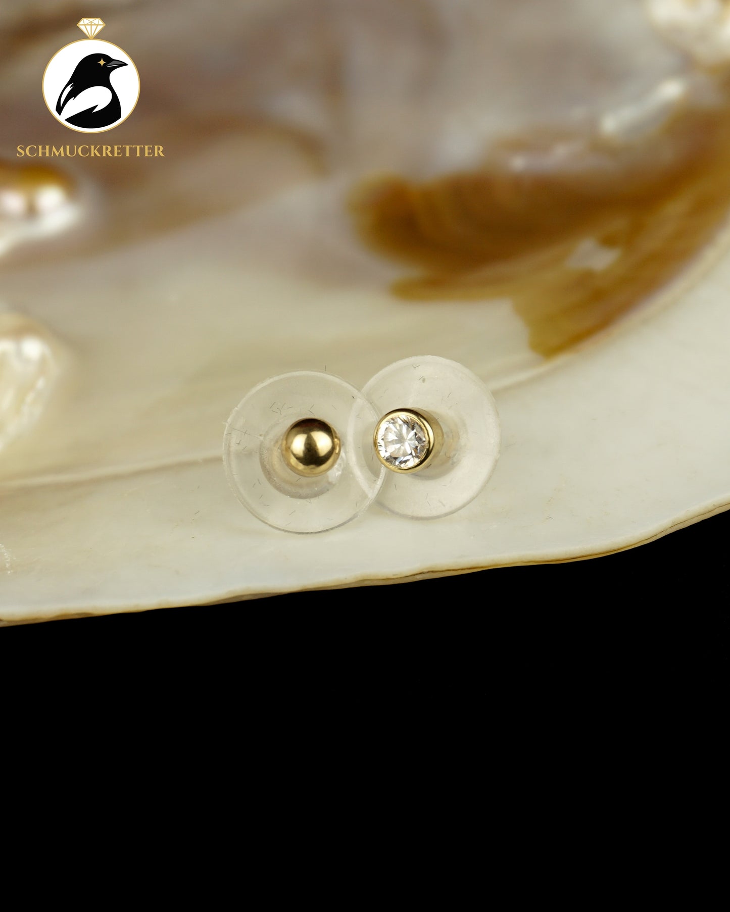 Zwei einzelne 585 Gold Ohrstecker
