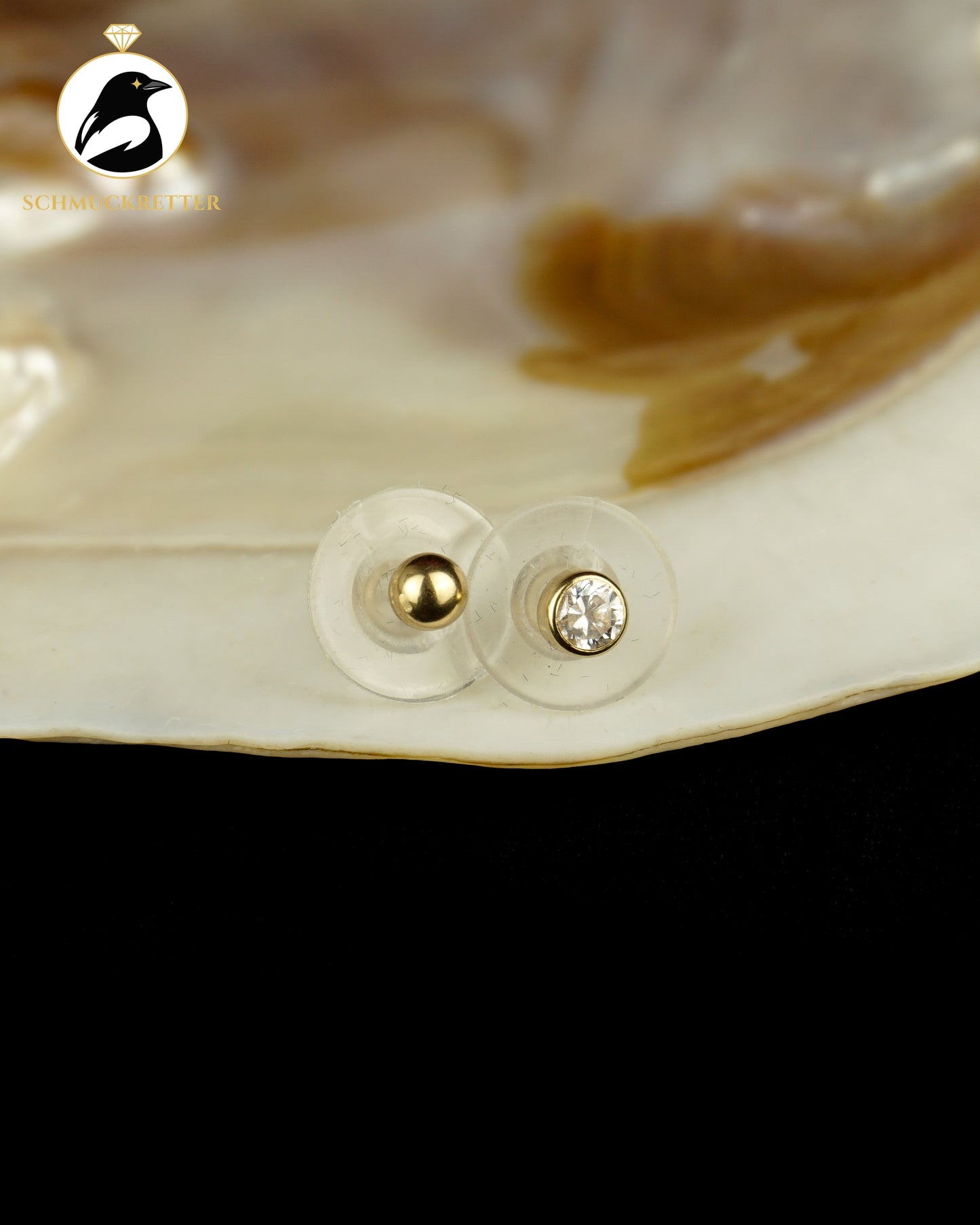 Zwei einzelne 585 Gold Ohrstecker