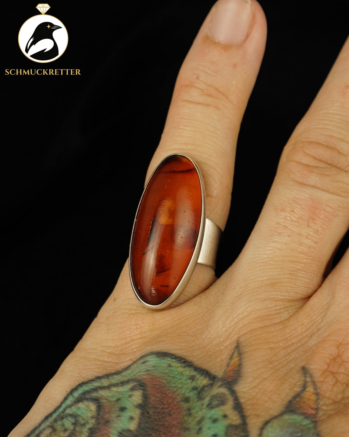 Ring mit ovalem Bernstein aus 830 Silber, Gr. 52